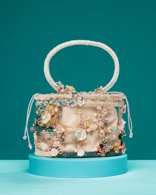 Legend Handbag with beaded cage design and pearl embellishments inspired by mermaids in the sea