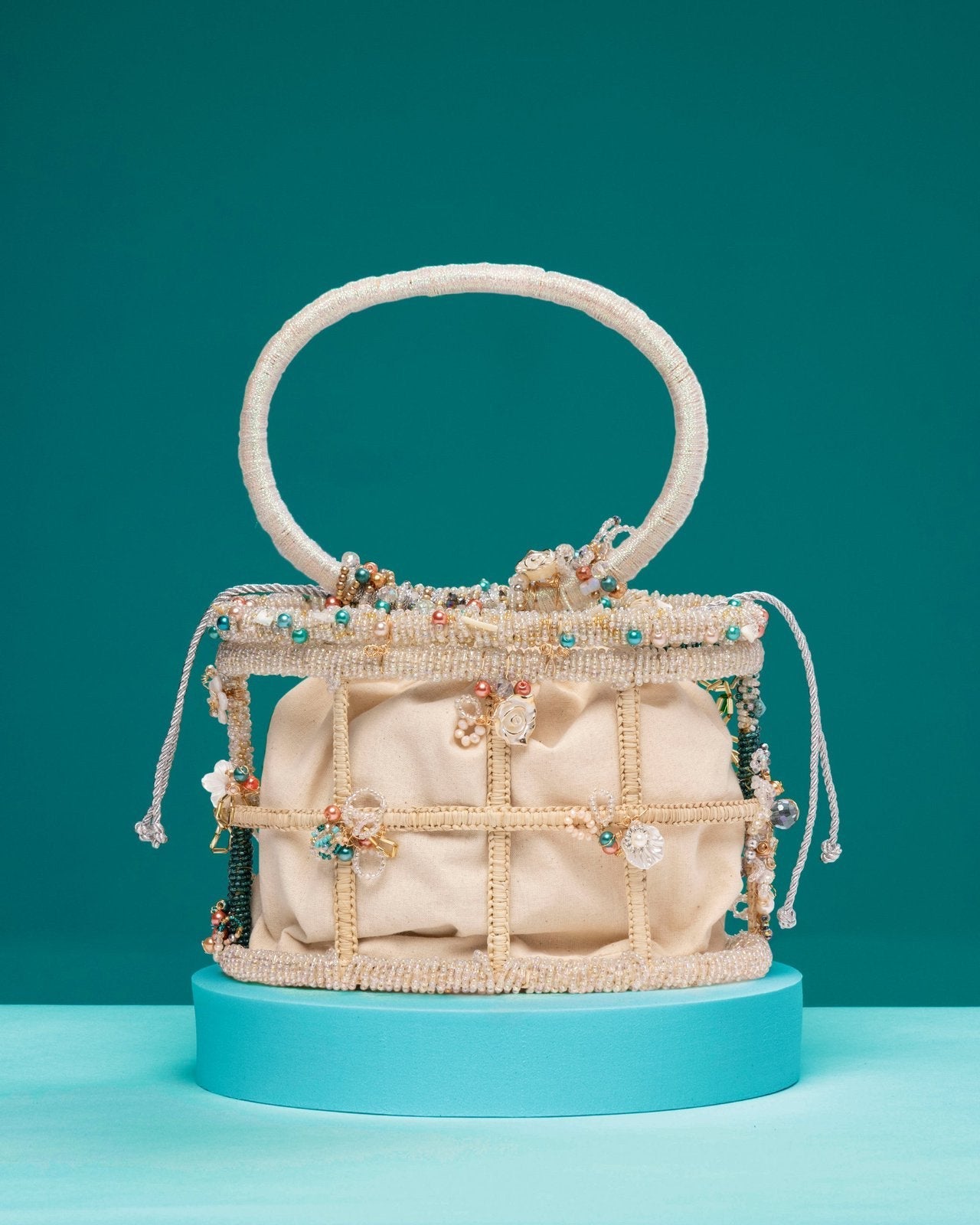 Legend Handbag with beaded cage design and pearl embellishments inspired by mermaids in the sea